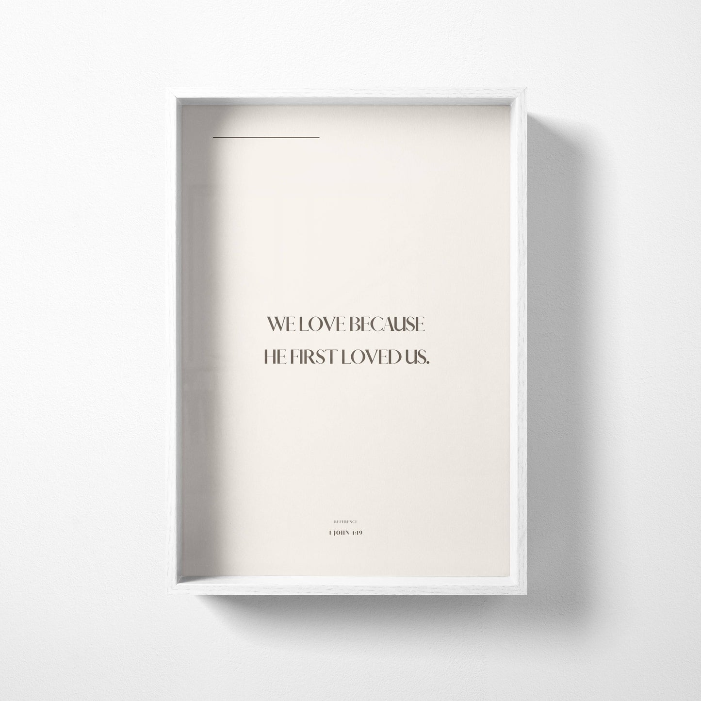 Neutral minimalist Christian wall art print with 1 John 4:19 typography on a soft beige background
