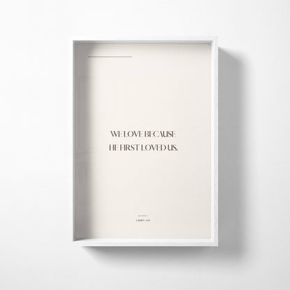 Neutral minimalist Christian wall art print with 1 John 4:19 typography on a soft beige background
