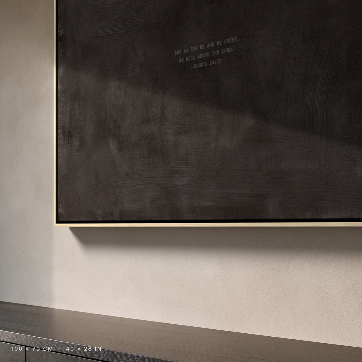 Charcoal canvas, 100 × 70 cm, natural floating frame, close-up above a dark oak sideboard in a Copenhagen interior