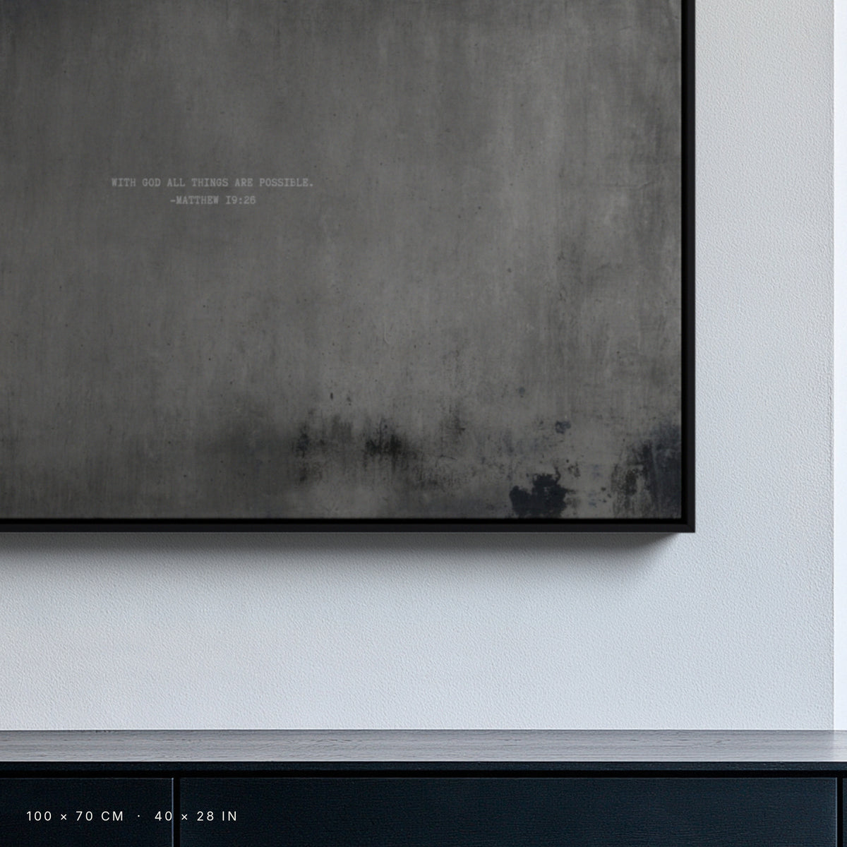 Graphite canvas, 100 × 70 cm, black floating frame, close-up above a black oak sideboard in a Berlin interior