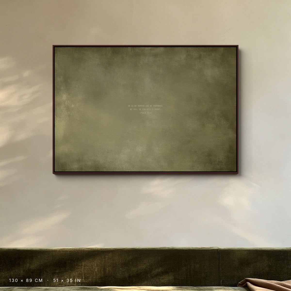 Olive canvas, 130 × 89 cm, walnut floating frame, above an olive velvet sofa in a London townhouse