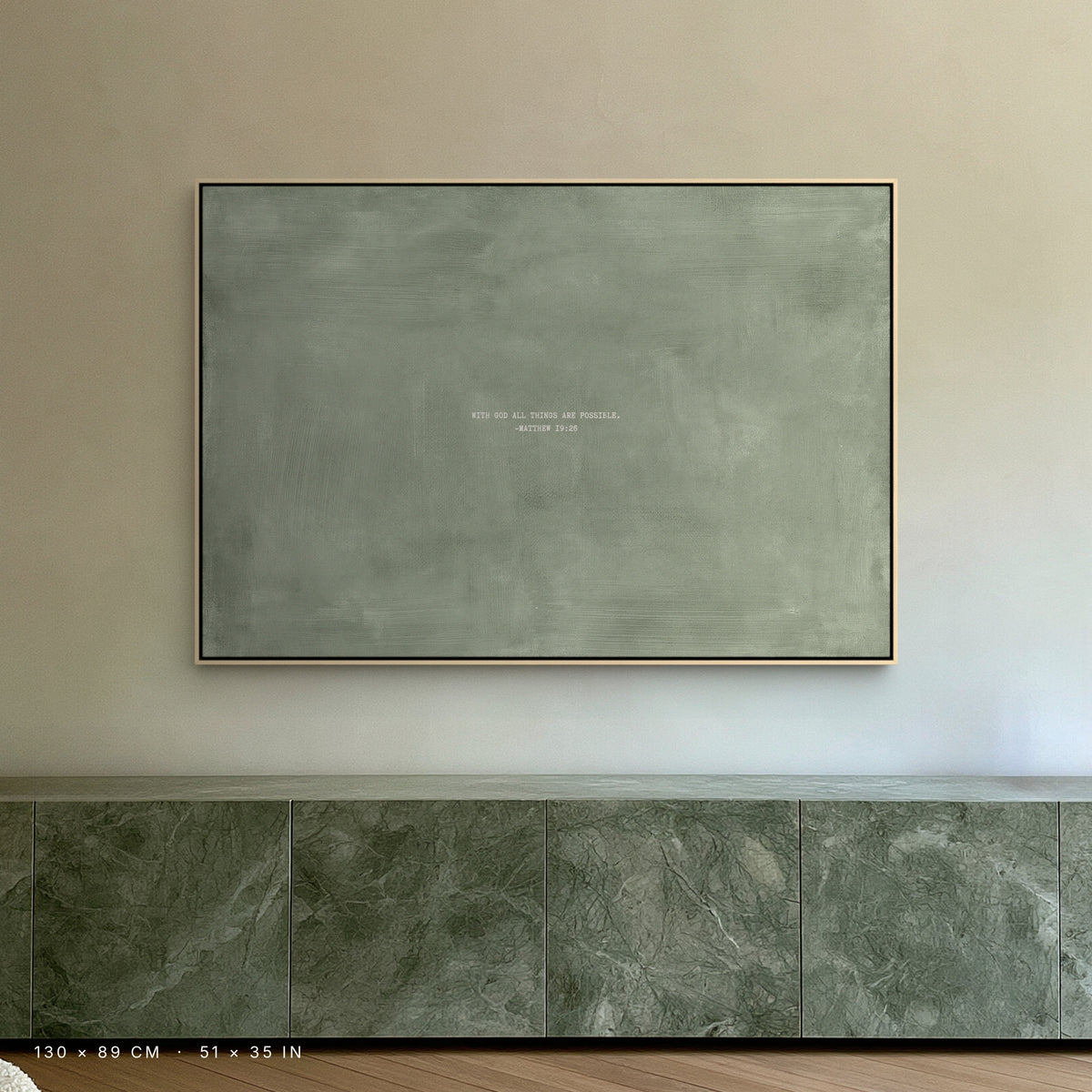 Sage canvas, 130 × 89 cm, natural floating frame, above a green marble sideboard in a London penthouse